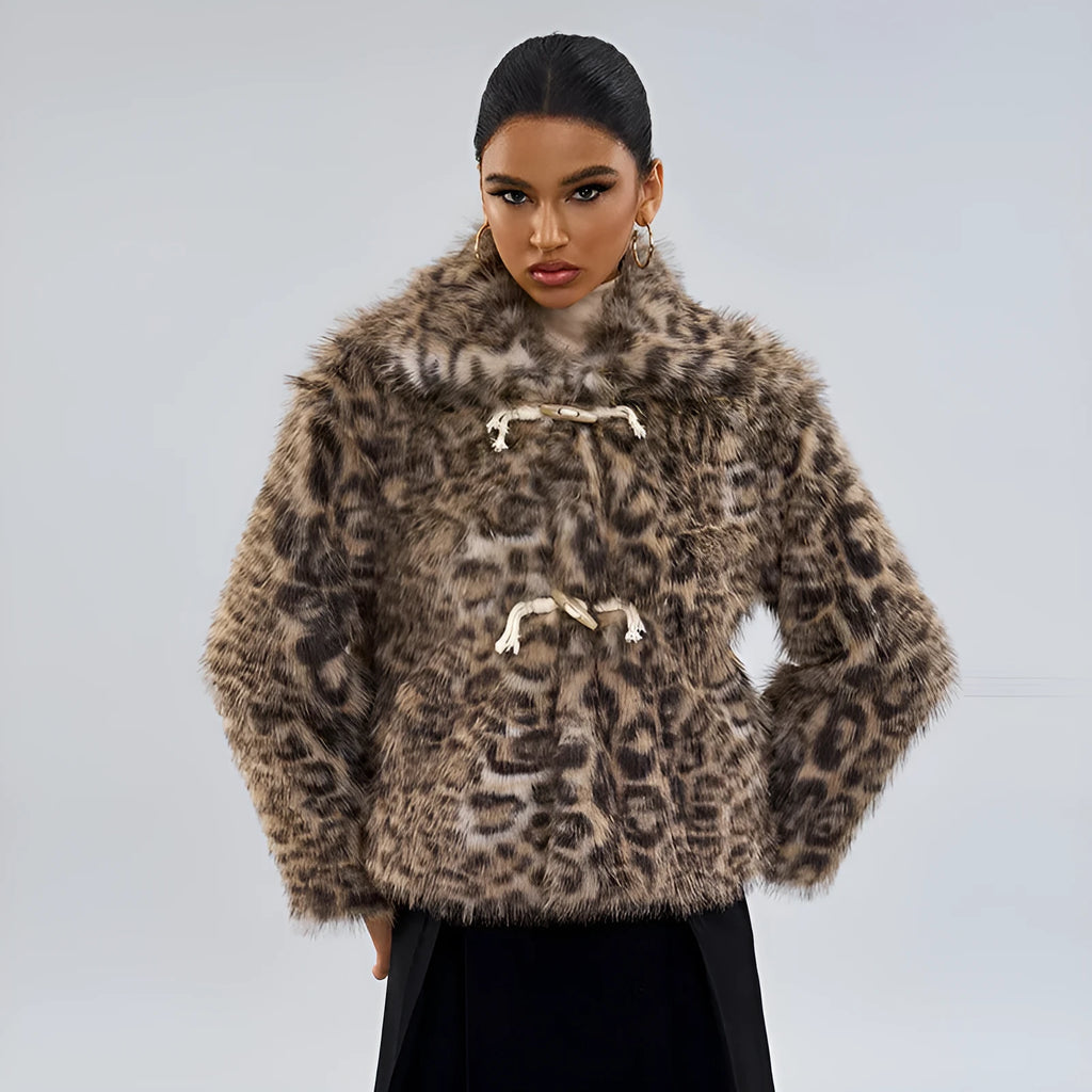 Women's leopard print coat with a buckle lapel fastening on a hanger.