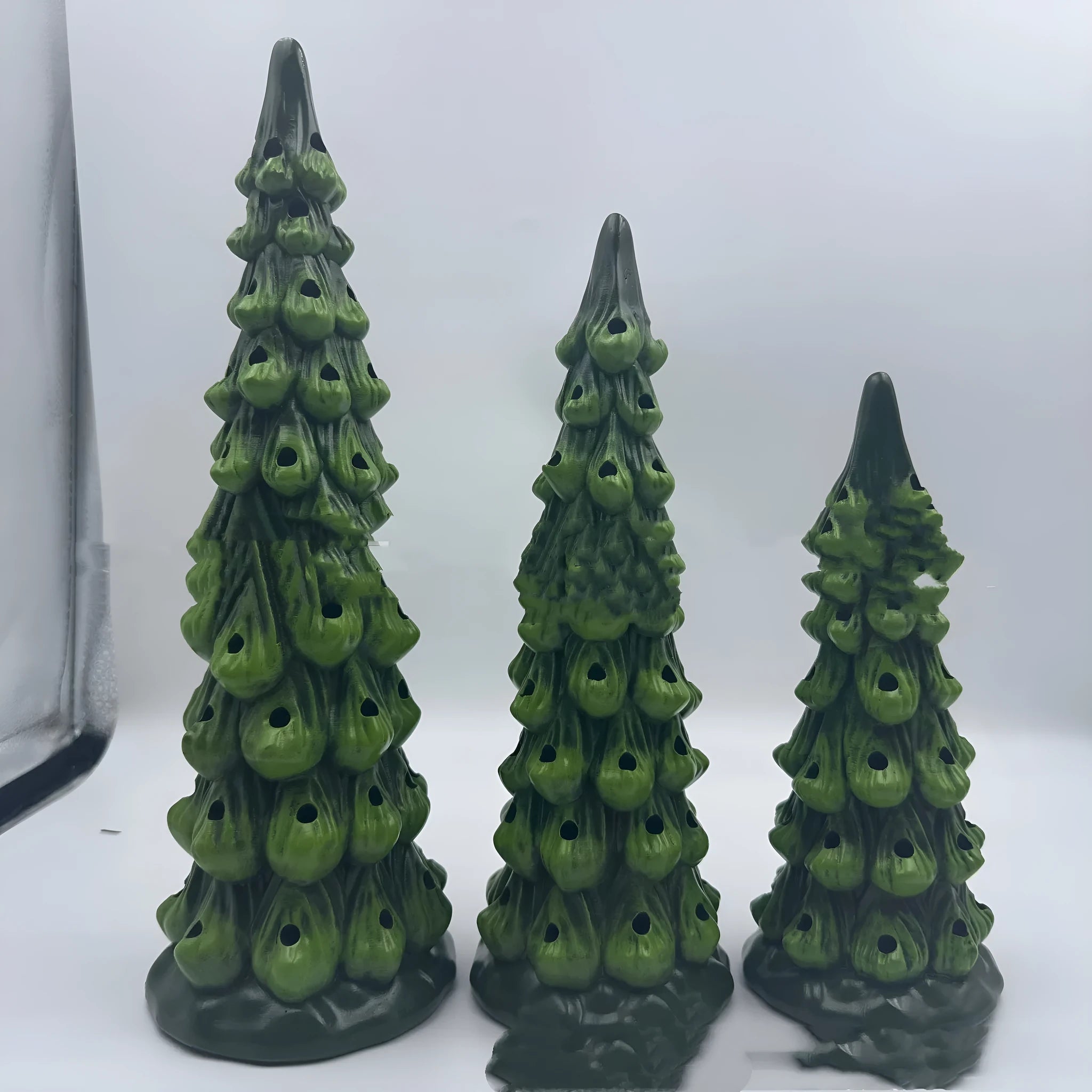 A resin Christmas tree decoration with lights, shown in a European style, suitable for indoor or courtyard use.