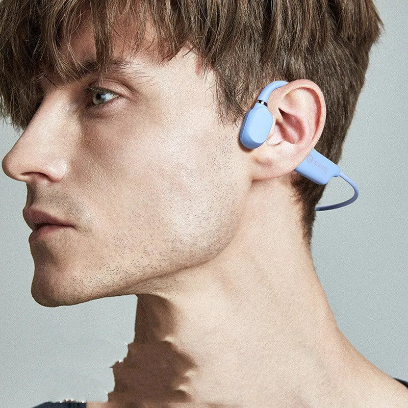 Bone conduction Bluetooth headset worn around the neck in retro green colour for sports running.