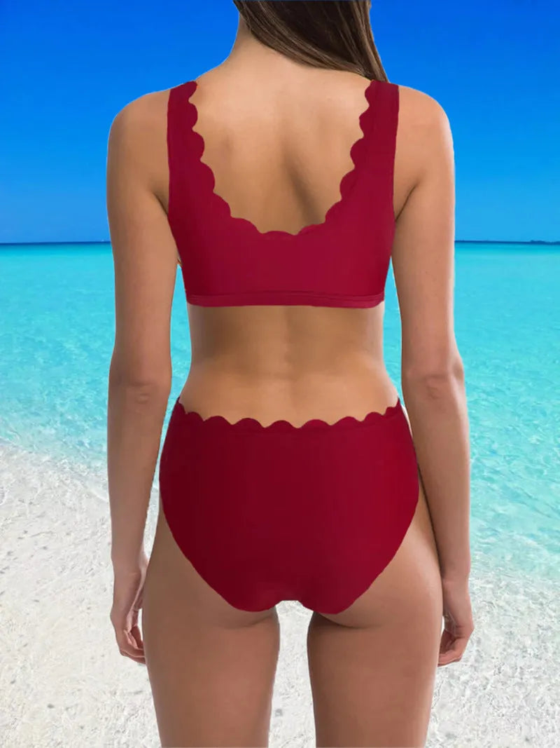 Women's red high waist split swimsuit with gathering detail on a mannequin.