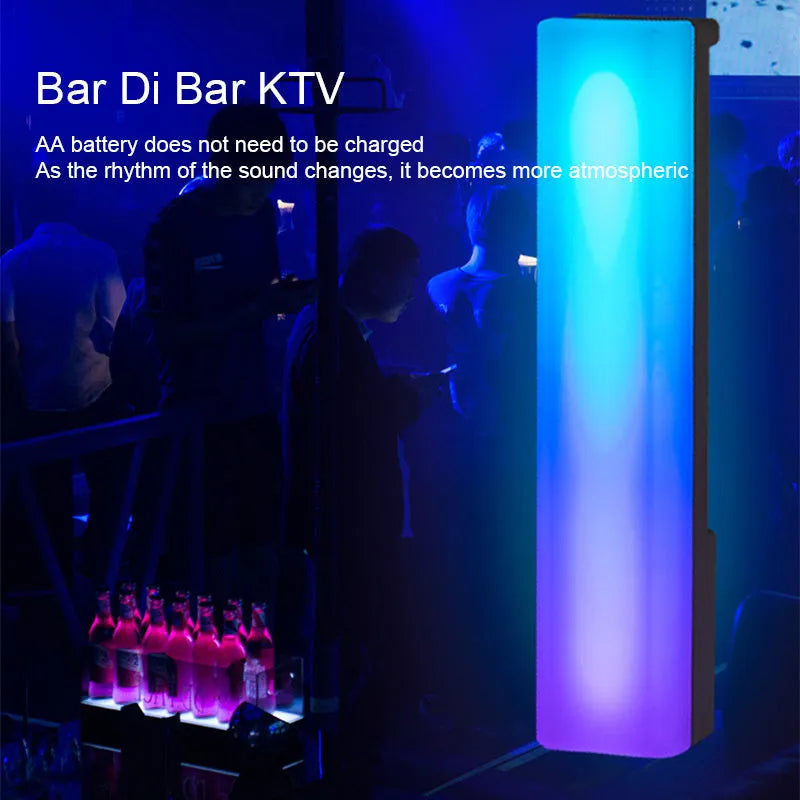 3D RGB voice-activated table lamp with colourful lights on a desk, showing white shell option.