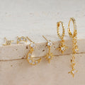 Six gold chain tassel earrings with zircon studs arranged as a complete jewellery set