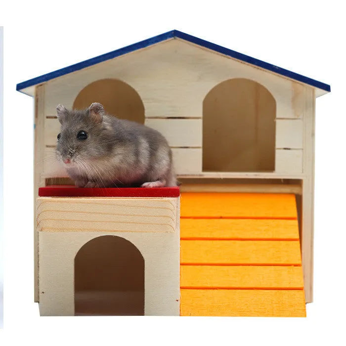 Blue-roofed wooden hamster chalet hideout and gnawing toy for small pets.