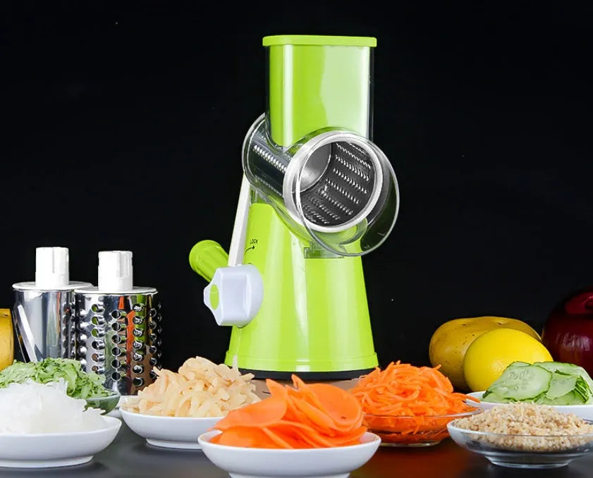 Blue round manual mandoline slicer with stainless steel blade for vegetables on a kitchen counter.