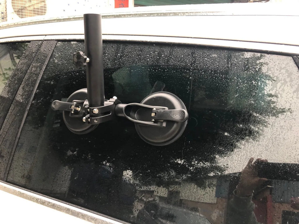 Black off-road car windscreen sucker base with a round glass suction cup and heavy rubber disc.