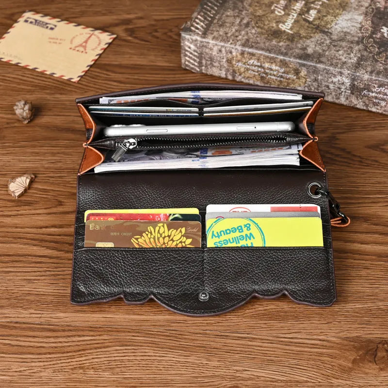 Retro brown women's tri-fold wallet with deep embossed floral pattern, shown open to reveal compartments.