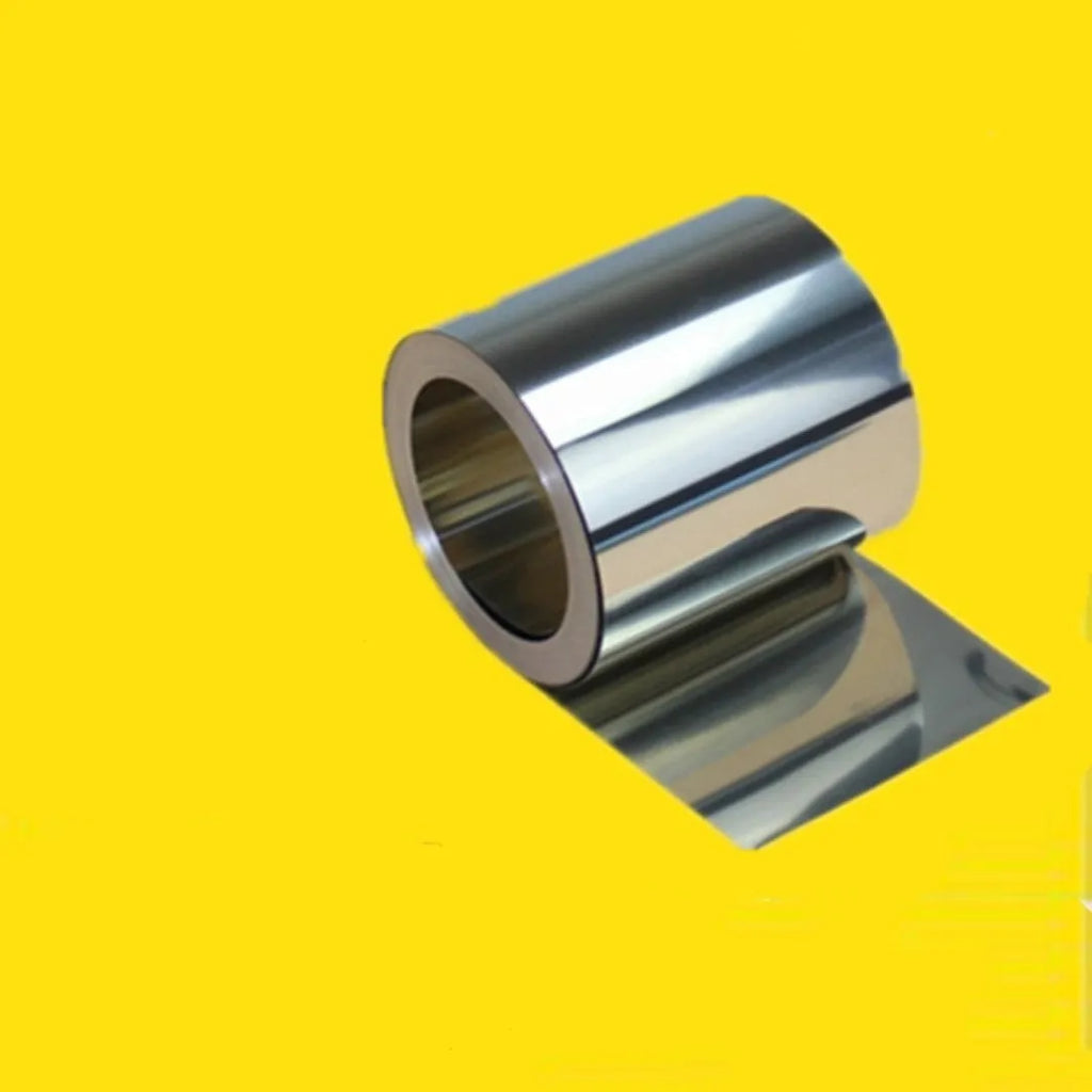 Close-up of a rolled 304 stainless steel metal strip with a leather item, showing its metallic finish and dimensions.