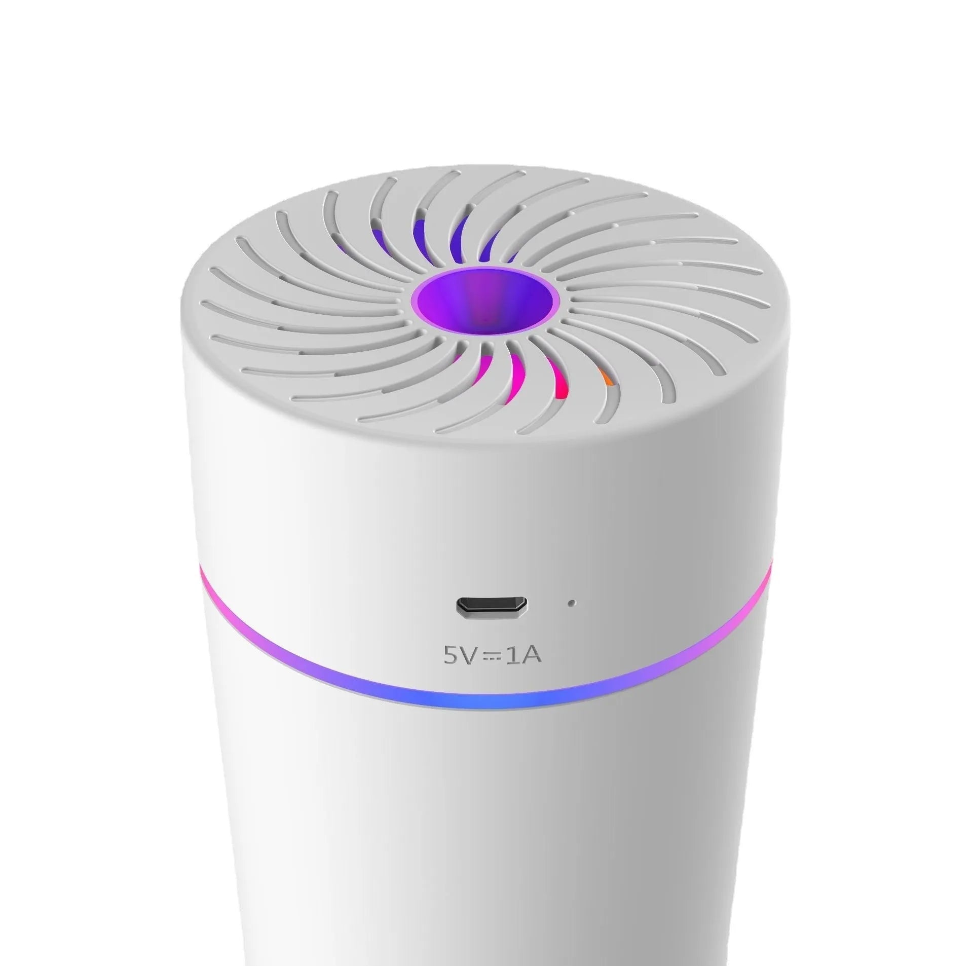 A small white or black USB car humidifier with aromatherapy function on a car dashboard.