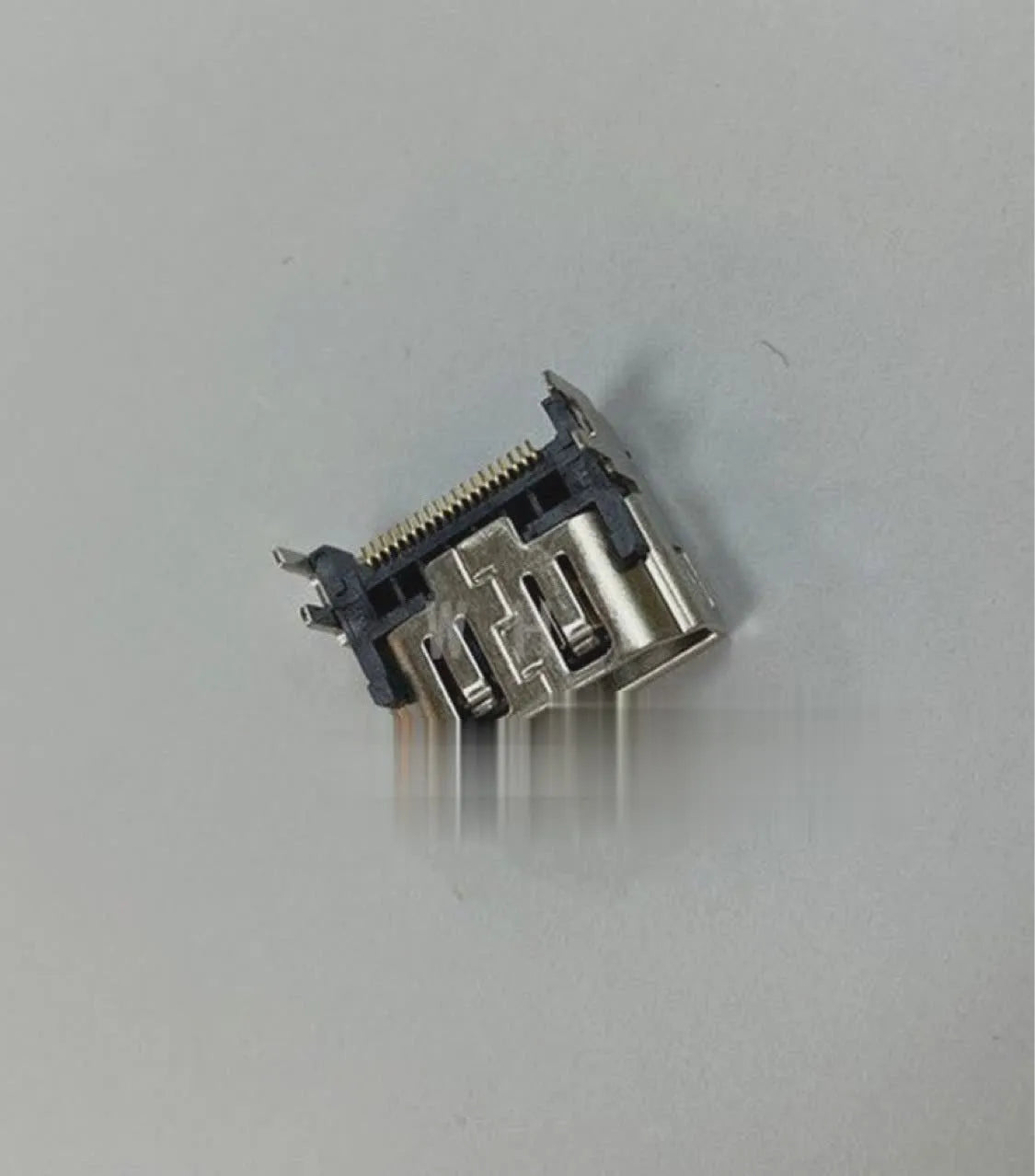 Silver metal HDMI host interface socket for device integration.