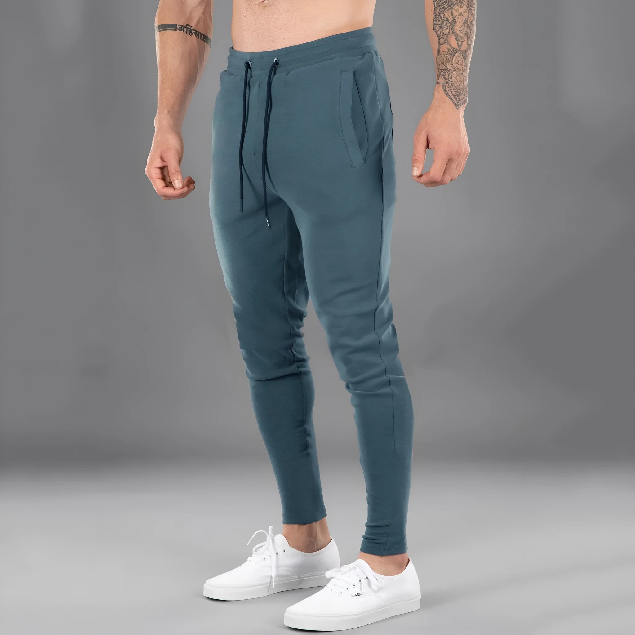 Men's casual cotton stretch sports trousers in peacock blue, mid-waist skinny fit, available in sizes M to 3XL