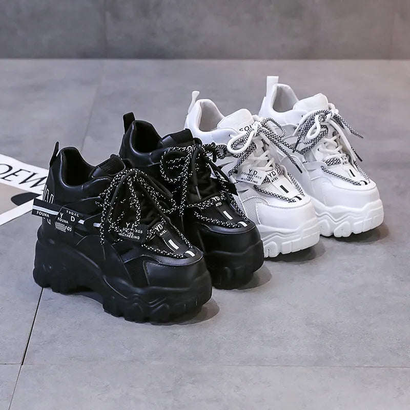 Women's white mesh platform sports shoes with cross strap and thick rubber sole.
