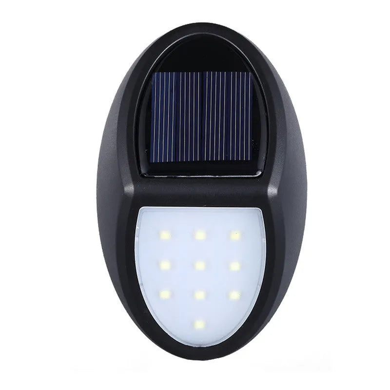 Black rectangular solar-powered LED wall light for outdoor garden use.