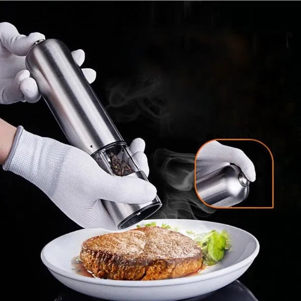 Stainless steel electric pepper grinder with manual option in natural colour.