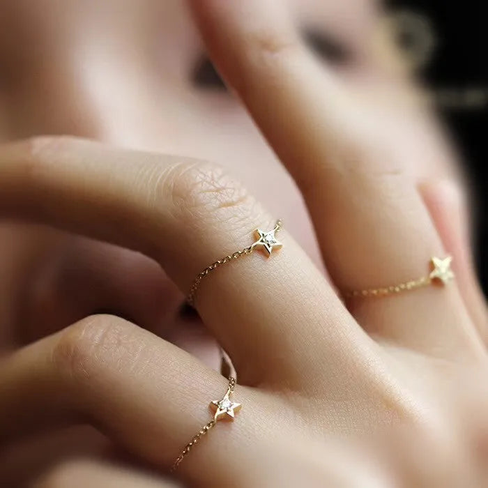 18K yellow gold adjustable star ring with two diamonds on hand, women's light luxury design