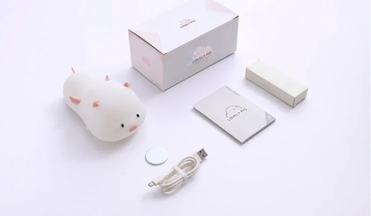 Blue silicone pig night light with sleeping expression and rechargeable battery