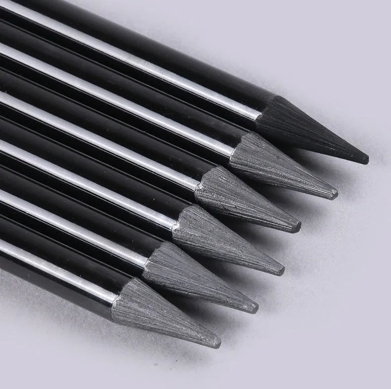 Set of nine wooden drawing pencils, six graphite and three carbonized, on a suction card.