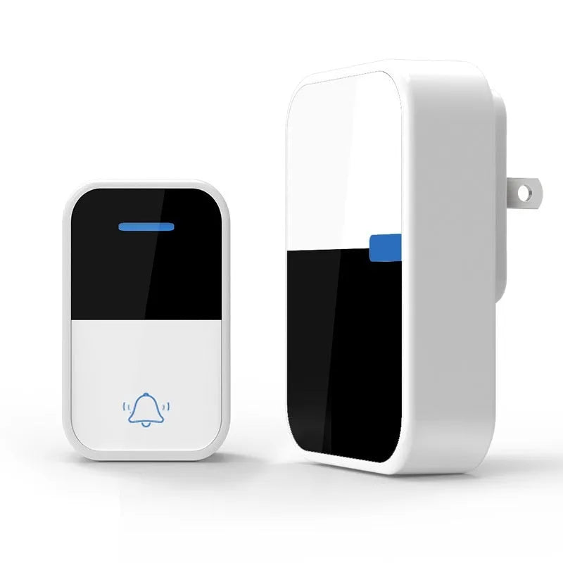 White self-powered wireless doorbell transmitter and plug-in receiver on a wooden table.