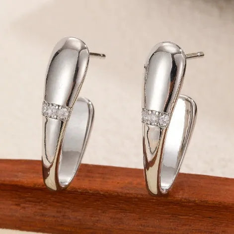 Simple square metal earrings in two styles on a clean background