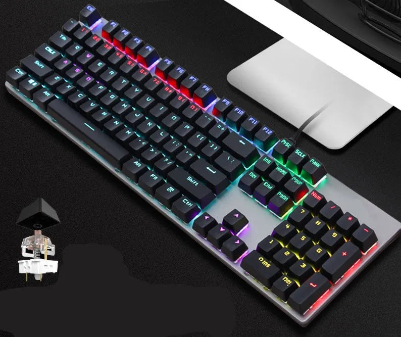 AOC GK410 black mechanical keyboard with backlit keys on a desk, showing full 104-key layout and metal construction