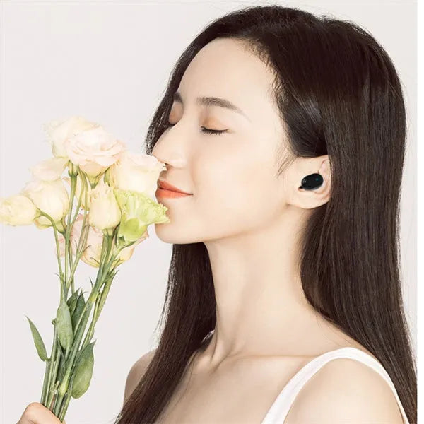 M1 Bluetooth wireless headset earbuds in black and white colour options showing stereo design