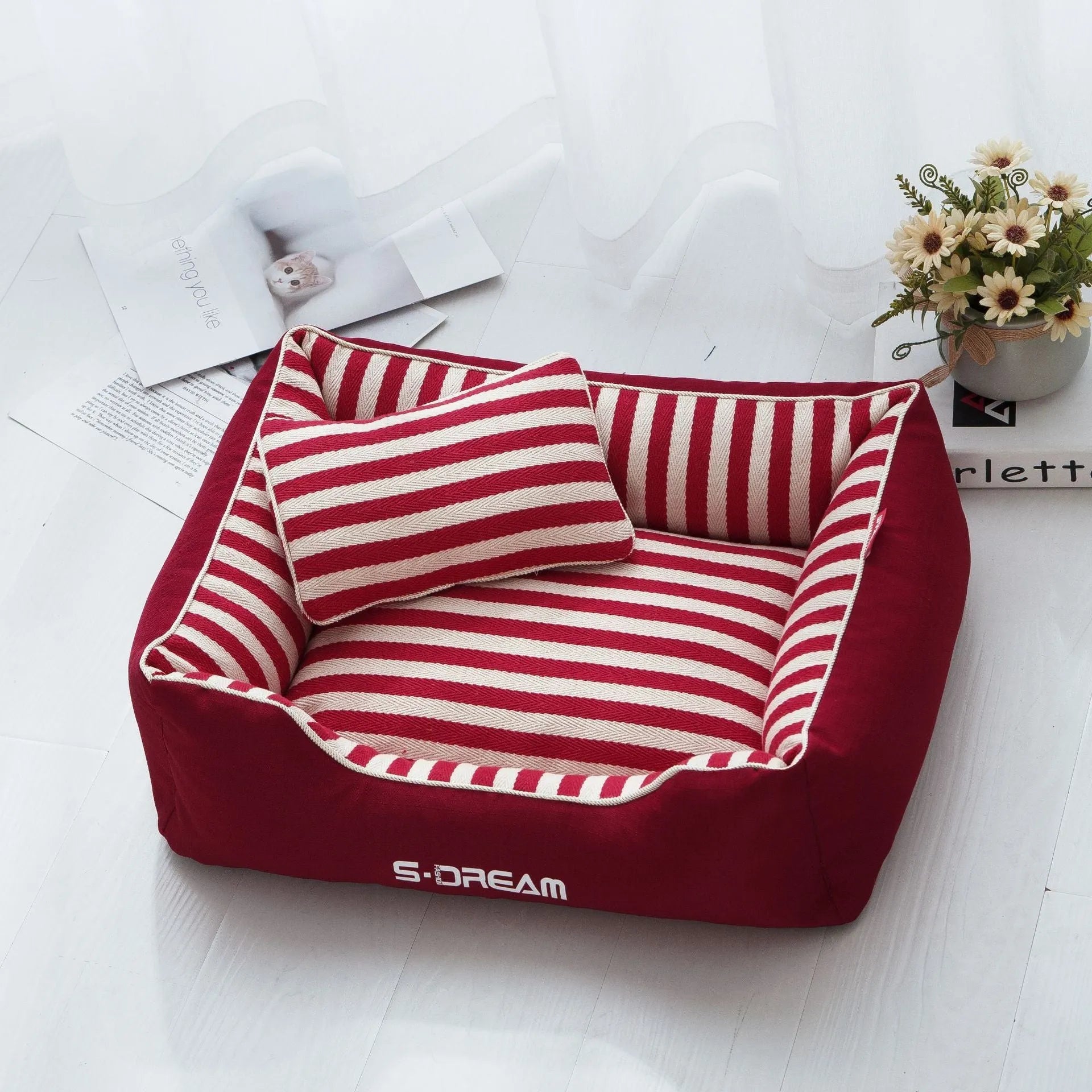 Navy stripes washable dog kennel mat with removable cover and a blue mini pillow, shown in an L size.