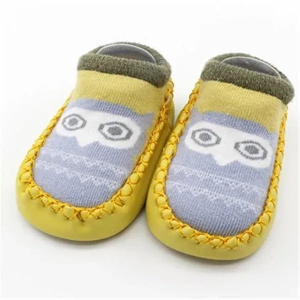Pair of pastel coloured baby socks with anti-slip dots on the sole, shown flat.