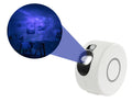 Galaxy starry sky projector rotating with 7 colours on a shelf, remote control next to it