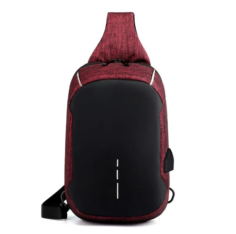 Dark blue Oxford cloth chest bag with adjustable strap, shown open to reveal internal mobile phone pocket.