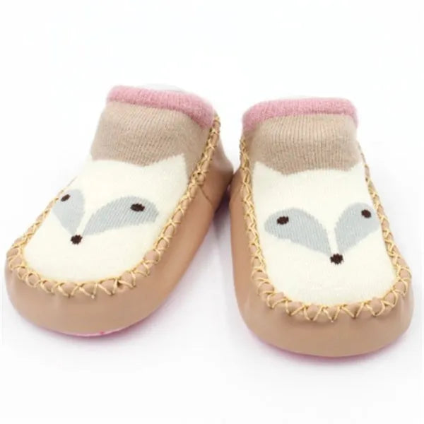 Pair of pastel coloured baby socks with anti-slip dots on the sole, shown flat.
