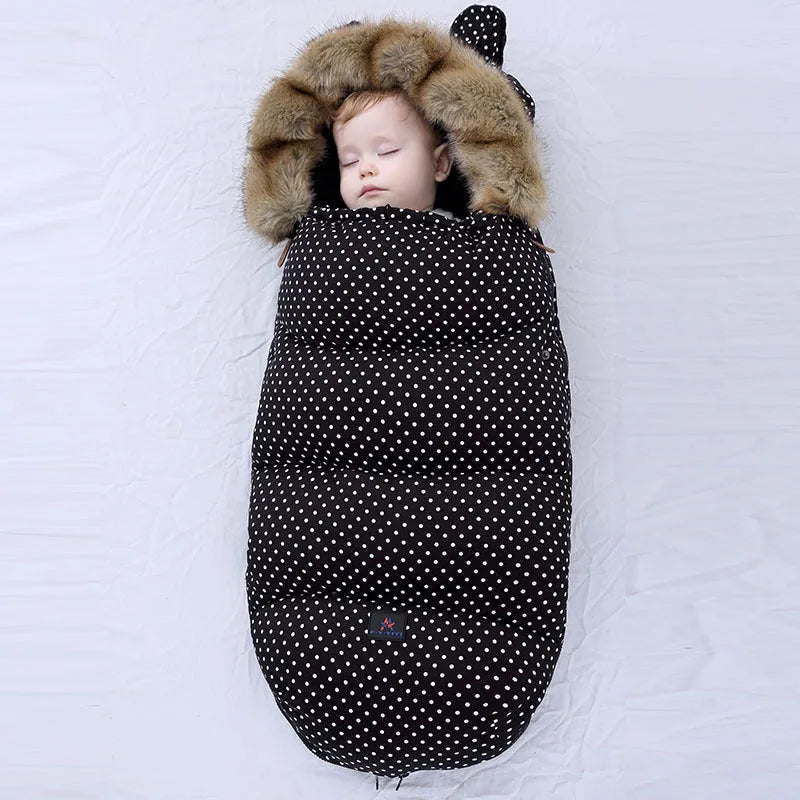 Baby warm cocoon style sleeping bag on a neutral background demonstrating solid colour design with zip closure