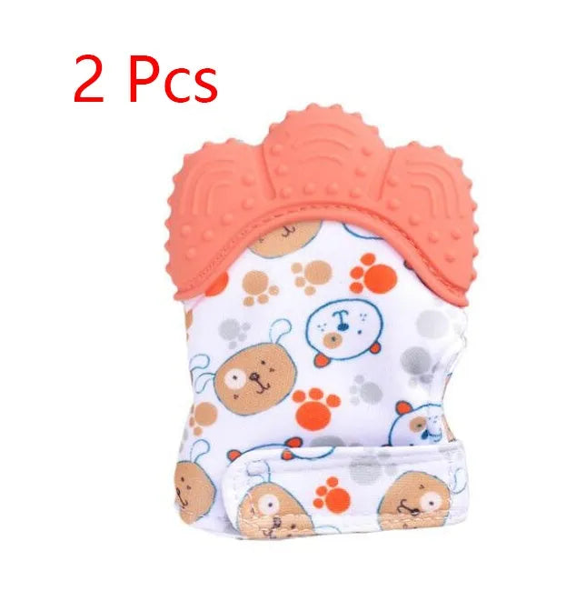 BPA-free silicone baby teether glove fastened with a white Velcro strap on a baby's hand
