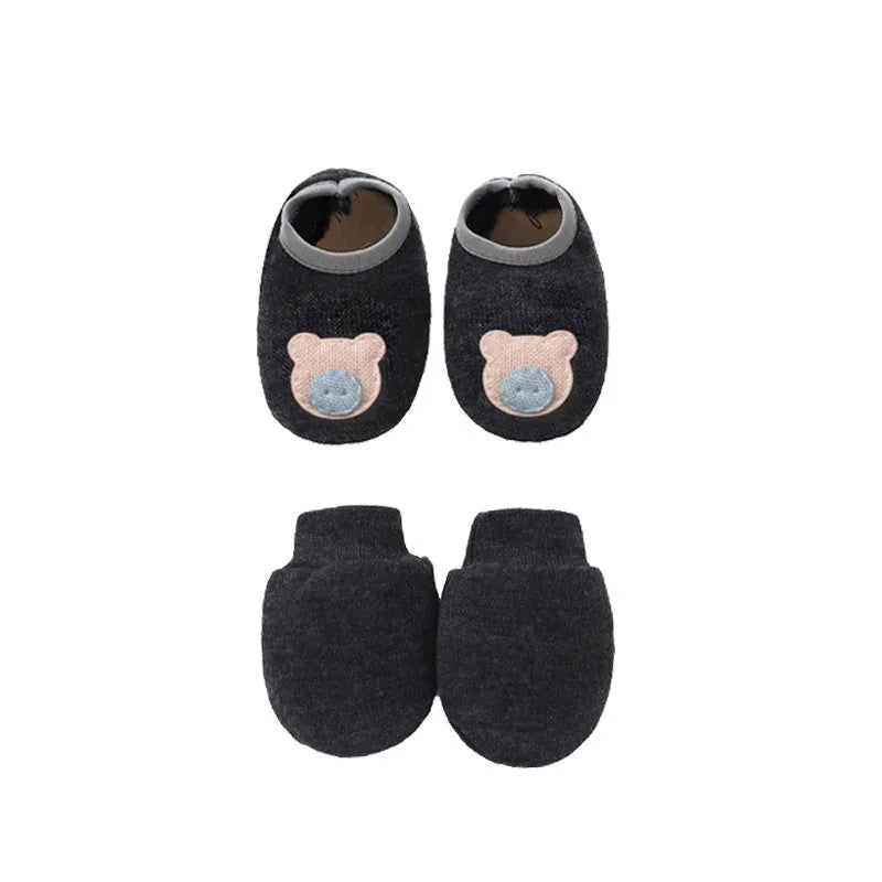 Set of white, light blue, and grey cotton baby pullover caps, gloves, and foot covers for infants.