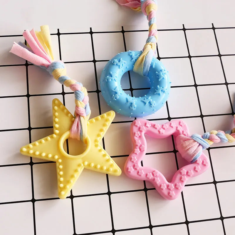 Non-toxic rubber dog training toy in star shape with teeth-cleaning surface design, available in pink blue and yellow