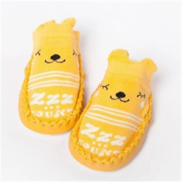 Pair of pastel coloured baby socks with anti-slip dots on the sole, shown flat.