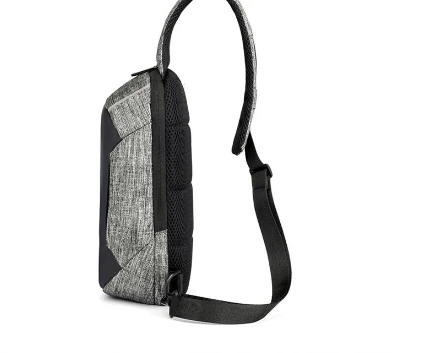 Dark blue Oxford cloth chest bag with adjustable strap, shown open to reveal internal mobile phone pocket.