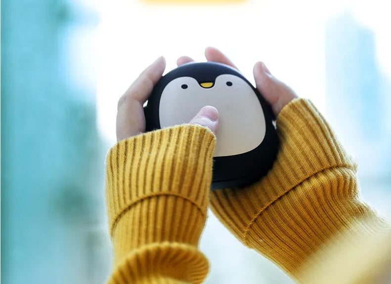 Cartoon penguin polar bear USB rechargeable hand warmer power bank showing black, white, and white-black colour options