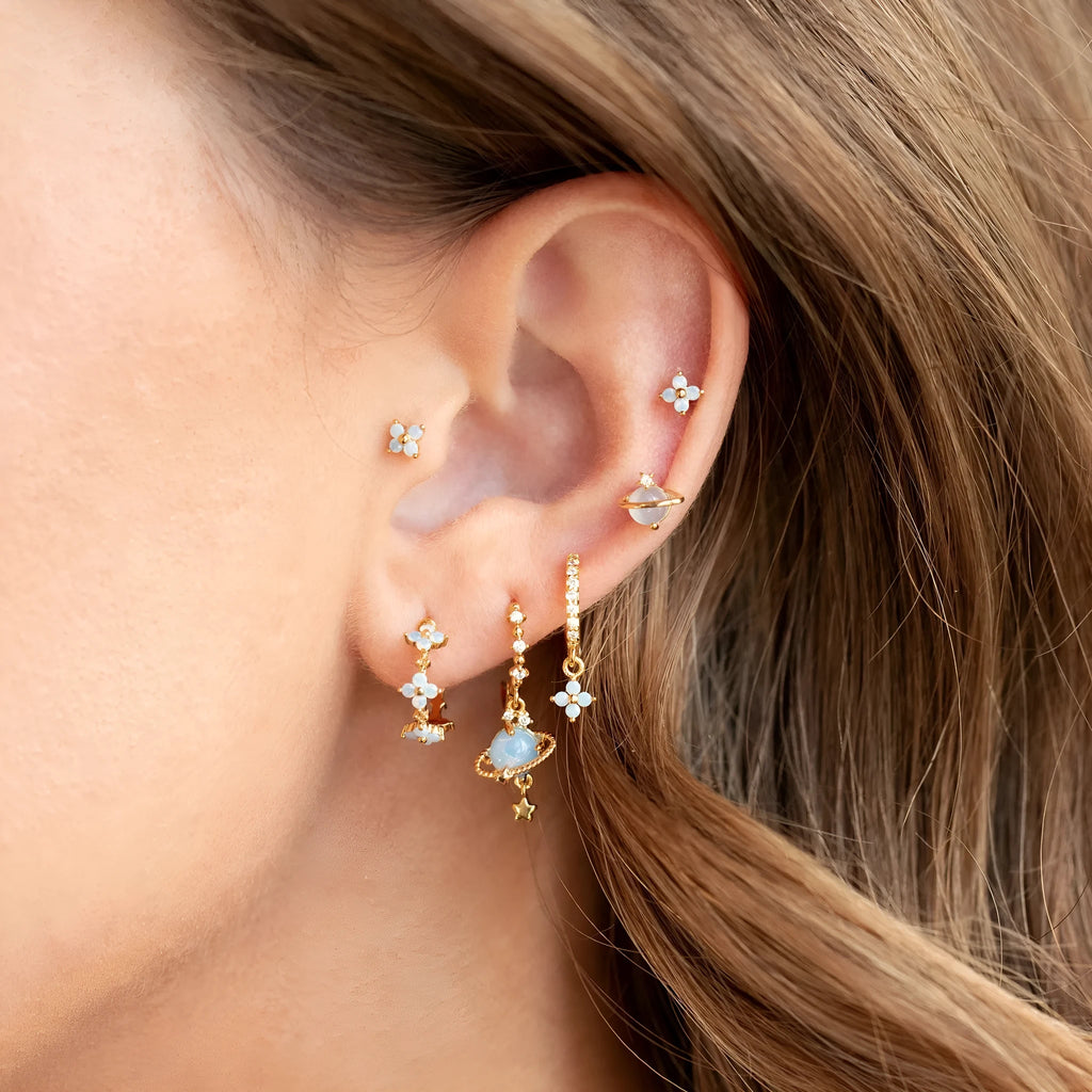 Gold and silver Japanese Korean style ear studs with blue flower nail design and zircon detail