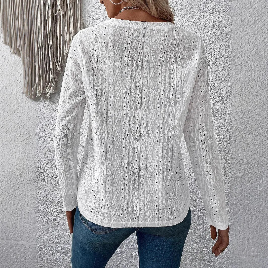 White loose fit women's long sleeve round neck t-shirt laid flat