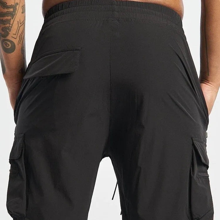 Men's black fitness shorts with four-way stretch and quick-dry fabric for running and gym workouts