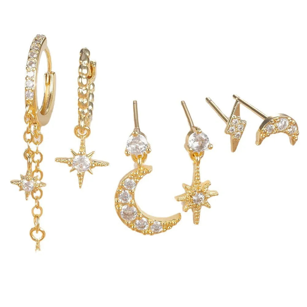 Six gold chain tassel earrings with zircon studs arranged as a complete jewellery set