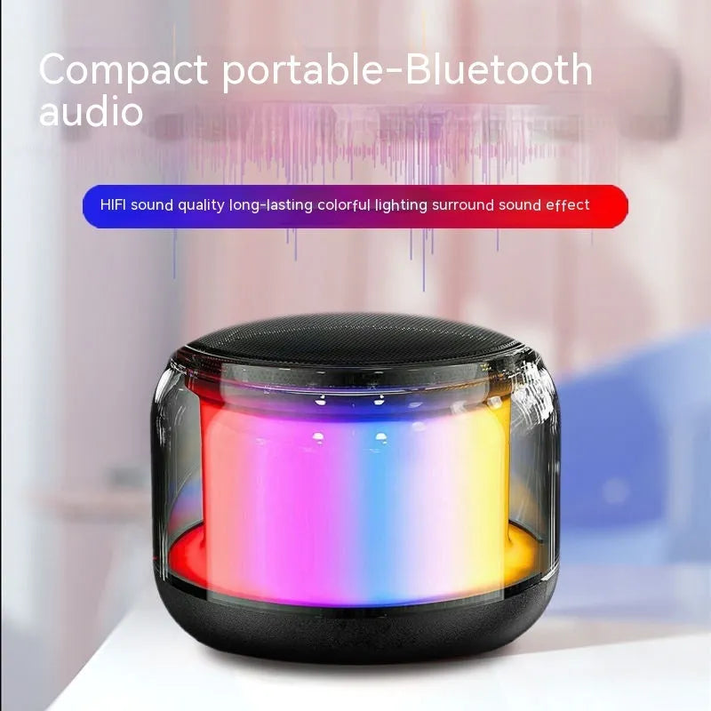 Black gun-shaped Bluetooth speaker with coloured glaze finish on desktop