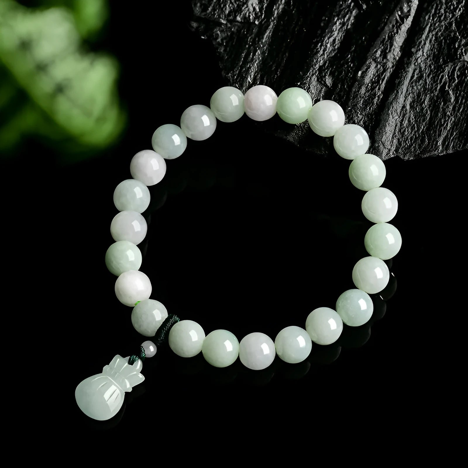 Jade stone bracelet with 8mm flower carving in unisex design for men and women