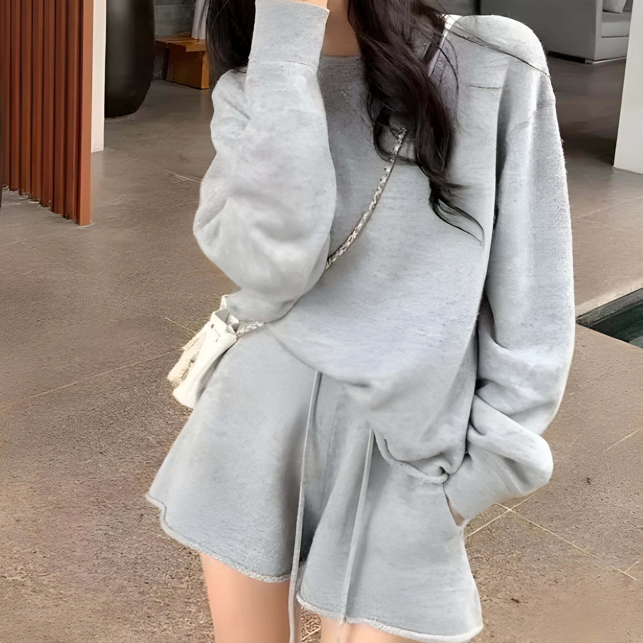 Women's loose-fit long sleeve acrylic knit sweater and matching wide-leg shorts set shown in oatmeal colour.