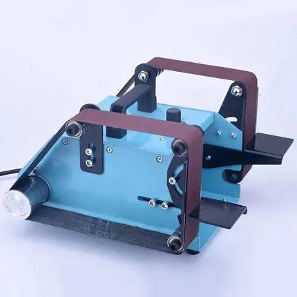 Blue desktop dual-head belt sander with variable speed dial on a workbench.