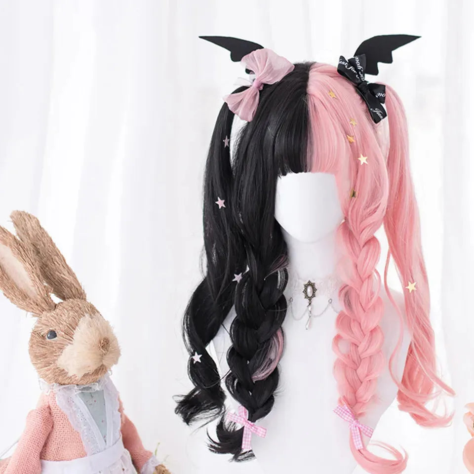 Long curly black and pink Lolita cosplay wig with a fringe on a display head.