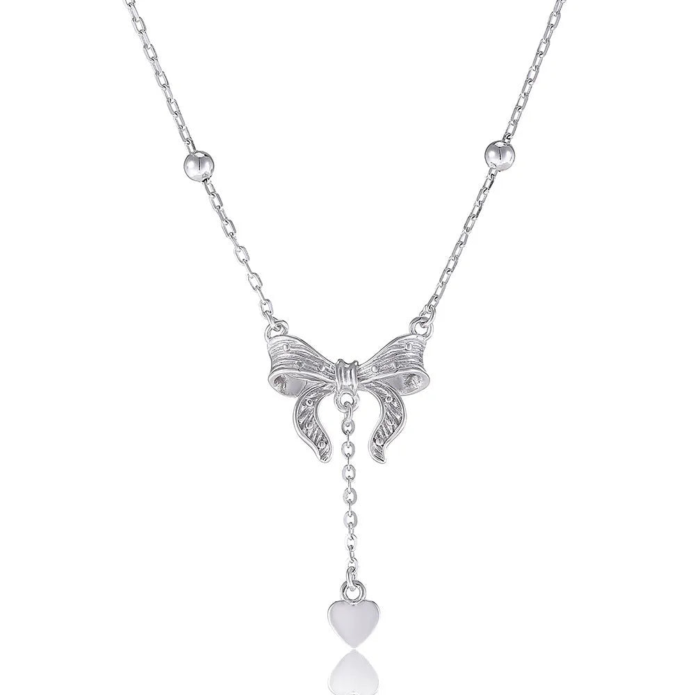 S925 sterling silver necklace with heart and bow pendant on an adjustable O-ring chain.