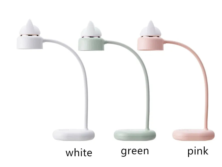 White rechargeable LED clip desk lamp with touch controls on a wooden desk.