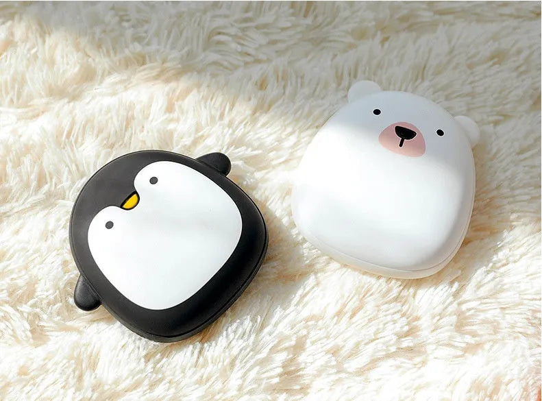 Cartoon penguin polar bear USB rechargeable hand warmer power bank showing black, white, and white-black colour options
