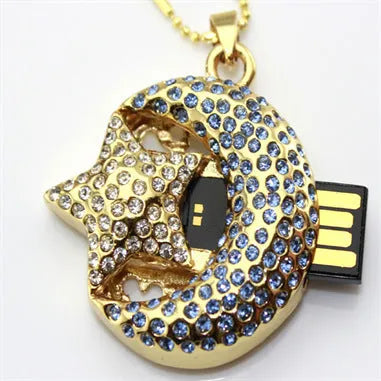 Silver Jewelry Xingyue metal USB flash drive on a keyring against a plain background.