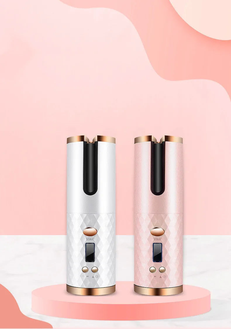 Pink rechargeable automatic hair curler with LCD screen and rotating ceramic barrel on a white background.